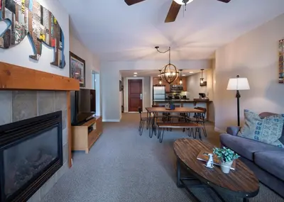 a living room with a couch a table and a tv at Winter Park FF Premium-Rated 4457 in Winter Park