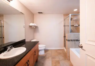 a bathroom with a sink and a toilet and a shower at Winter Park FF Premium-Rated 4457 in Winter Park