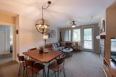 a living room with a table and a couch at Winter Park FF Premium-Rated 4457 in Winter Park