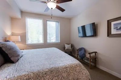 a bedroom with a bed and a ceiling fan at Winter Park FF Premium-Rated 4457 in Winter Park