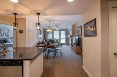a kitchen and living room with a dining room at Winter Park FF Premium-Rated 4457 in Winter Park