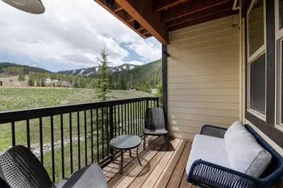 a porch with a couch and chairs on a balcony at Winter Park FF Premium-Rated 4462 in Winter Park