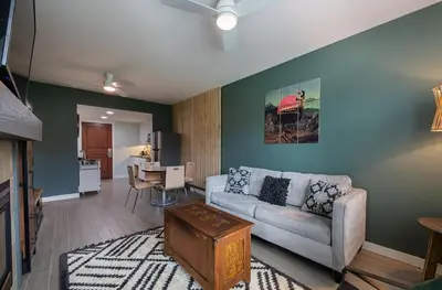 a living room with a couch and a table at Winter Park FF Premium-Rated 4462 in Winter Park