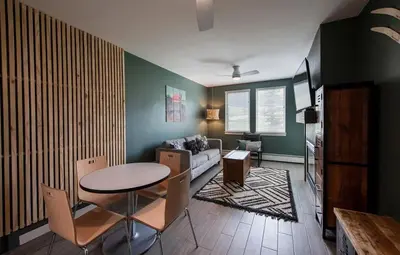 a living room with a table and a couch at Winter Park FF Premium-Rated 4462 in Winter Park