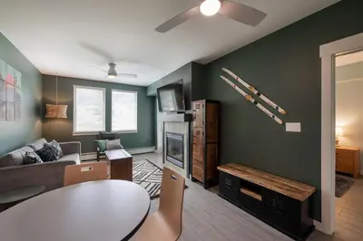 a living room with a table and a couch at Winter Park FF Premium-Rated 4462 in Winter Park