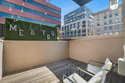 a balcony with chairs and a sign that reads new york at Good Hotels Downtown Denver in Denver