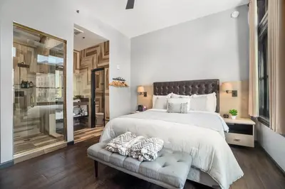 a bedroom with a large bed and a couch at Good Hotels Downtown Denver in Denver