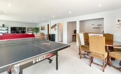 a living room with a ping pong table at Trails End Vacation Home at Windcliff home in Estes Park