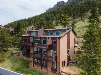 an aerial view of a building on a hill at Trails End Vacation Home at Windcliff home in Estes Park