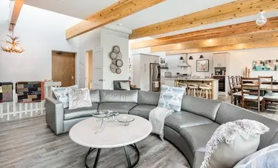 a living room with a couch and a table at Trails End Vacation Home at Windcliff home in Estes Park