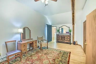 a living room with a dresser and a mirror at Moose Park Lodge Charming Walden Retreat! in Walden