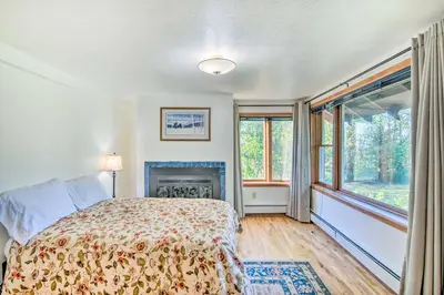 a bedroom with a bed and a fireplace at Moose Park Lodge Charming Walden Retreat! in Walden