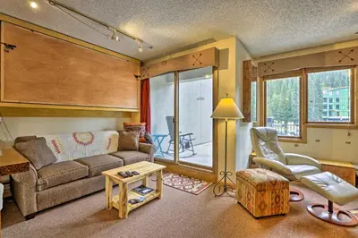 a living room with a couch and a chair at Ski-InandSki-Out Studio at Winter Park Base! in Winter Park