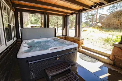 a hot tub sitting inside of a house at Aspen Mountain Lodge - #3357 in Estes Park