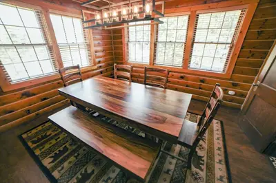 a dining room with a wooden table and chairs at Aspen Mountain Lodge - #3357 in Estes Park