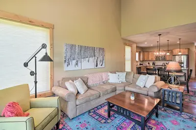 a living room with a couch and a table at Updated Mtn Home about 6 Mi to Winter Park Resort in Fraser