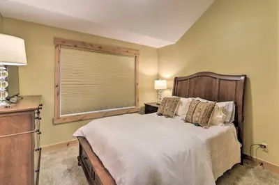 a bedroom with a large bed and a window at Updated Mtn Home about 6 Mi to Winter Park Resort in Fraser