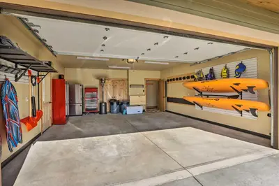 a garage with two kayaks on the wall at Updated Mtn Home about 6 Mi to Winter Park Resort in Fraser