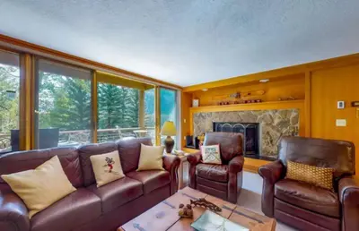 a living room with leather furniture and a fireplace at 1 Bedroom Condo In West Keystone Near Lakeside Village in Keystone