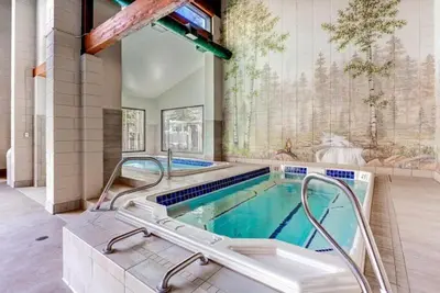 a swimming pool with a hot tub in a house at 1 Bedroom Condo In West Keystone Near Lakeside Village in Keystone