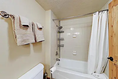 a bathroom with a shower and a toilet and a sink at 3 Bedroom Condo In West Keystone Near Lakeside Village in Keystone