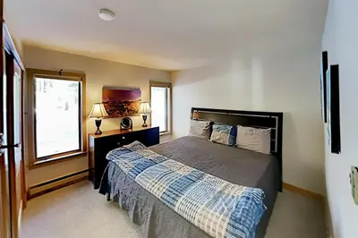 a bedroom with a large bed and a window at 3 Bedroom Condo In West Keystone Near Lakeside Village in Keystone