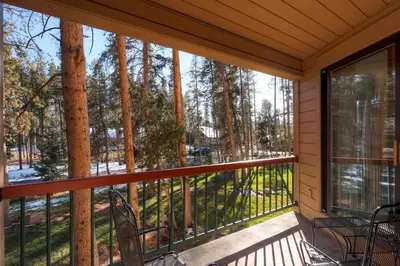 a screened porch with a view of the woods at North Keystone 1 Bedroom Near Conference Center in Keystone