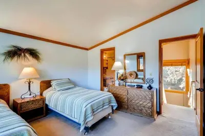 a bedroom with a bed and a mirror at North Keystone 2 Bedroom Near Conference Center in Keystone