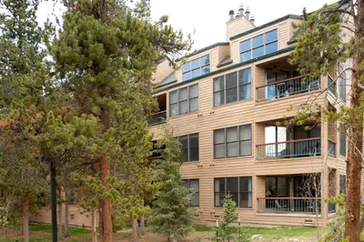 an apartment building with trees in front of it at North Keystone 2 Bedroom Near Conference Center in Keystone