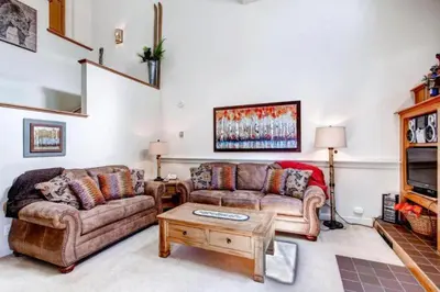 a living room with two couches and a coffee table at Soda Springs 1 Bedroom Townhome in Keystone