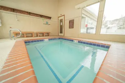 a large swimming pool with blue water in a building at 1 Bedroom Condo In Keystone - West Keystone in Keystone