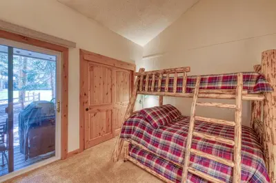 a bedroom with a bunk bed and a window at 2 Bedroom Condo In Keystone - West Keystone in Keystone