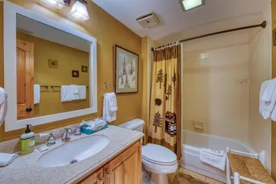 a bathroom with a sink and a toilet and a shower at 2 Bedroom Condo In Keystone - West Keystone in Keystone