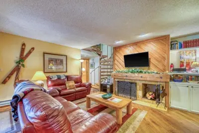 a living room with a couch and a fireplace at 2 Bedroom Condo In Keystone - West Keystone in Keystone