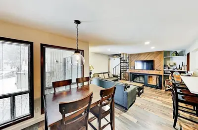 a dining room and living room with a dining table at 3 Bedroom Condo In Keystone - West Keystone in Keystone
