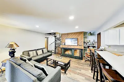 a living room with a couch and a fireplace at 3 Bedroom Condo In Keystone - West Keystone in Keystone