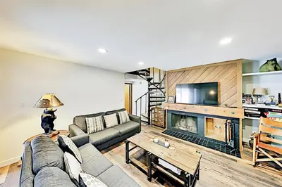 a living room with a couch and a fireplace at 3 Bedroom Condo In Keystone - West Keystone in Keystone