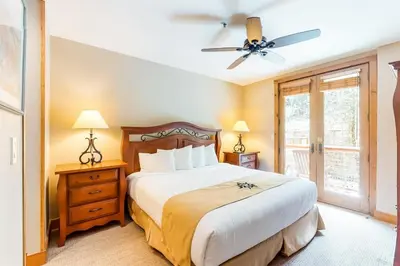 a bedroom with a bed and a ceiling fan at 2 Bedroom Ski-In, Ski-Out Condo At The Timbers in Keystone