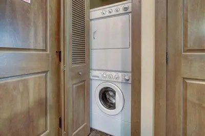a washer and dryer in a room with a door at Lone Eagle 2 Bedroom Condo in Dillon