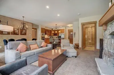 a living room with a couch and a fireplace at Lone Eagle 2 Bedroom Condo in Dillon