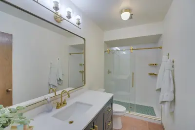 a bathroom with a sink and a shower at Mtn View Granby Condo with In-Unit Hot Tub! in Granby