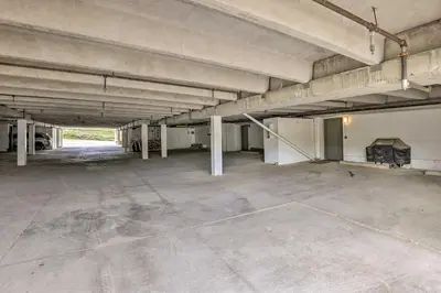 an empty parking lot in an empty parking garage at Mtn View Granby Condo with In-Unit Hot Tub! in Granby