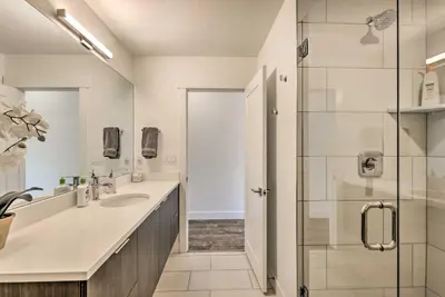 a bathroom with a sink and a shower at Hot Tub and Balcony Riverfront Silverthorne Condo! in Silverthorne