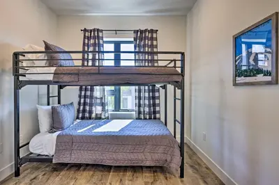 a couple of bunk beds in a room at Hot Tub and Balcony Riverfront Silverthorne Condo! in Silverthorne