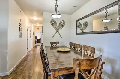 a dining room with a wooden table and chairs at Balcony and Grill Mtn-View Retreat in Granby! in Granby