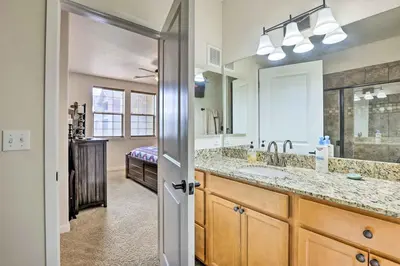 a bathroom with a sink and a large mirror at Balcony and Grill Mtn-View Retreat in Granby! in Granby