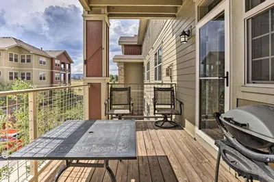 a porch with a table and chairs on a balcony at Balcony and Grill Mtn-View Retreat in Granby! in Granby