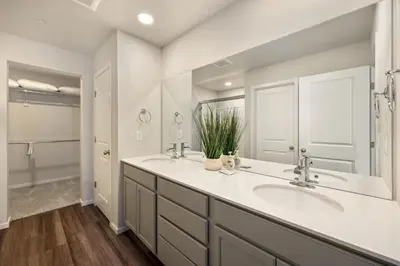a bathroom with two sinks and a shower at Modern Farmhouse Townhome - Great Central Location in Fort Collins