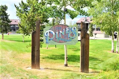 a sign in a park in a field at Pines at Meadow Ridge in Fraser