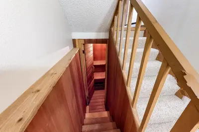 a staircase with wooden railings in a house at Vasquez Vista in Winter Park